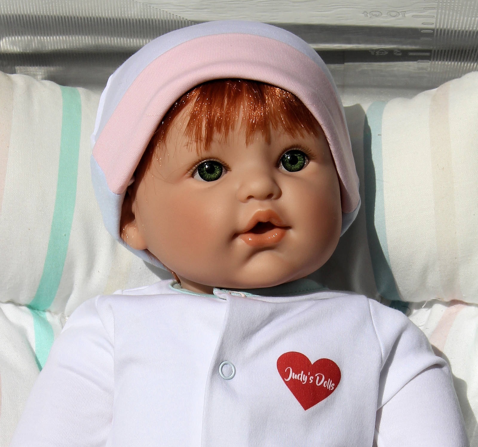 Judy's Doll Shop | Magic Baby - Red Hair, Green Eyes White Onesie